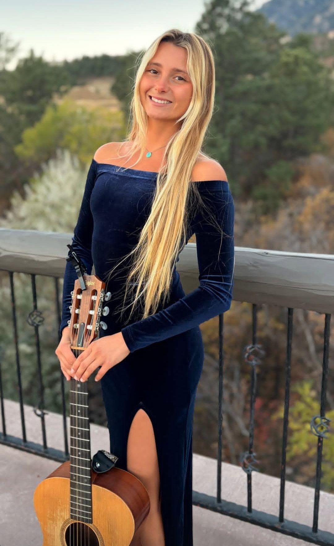 blonde girl holding guitar 