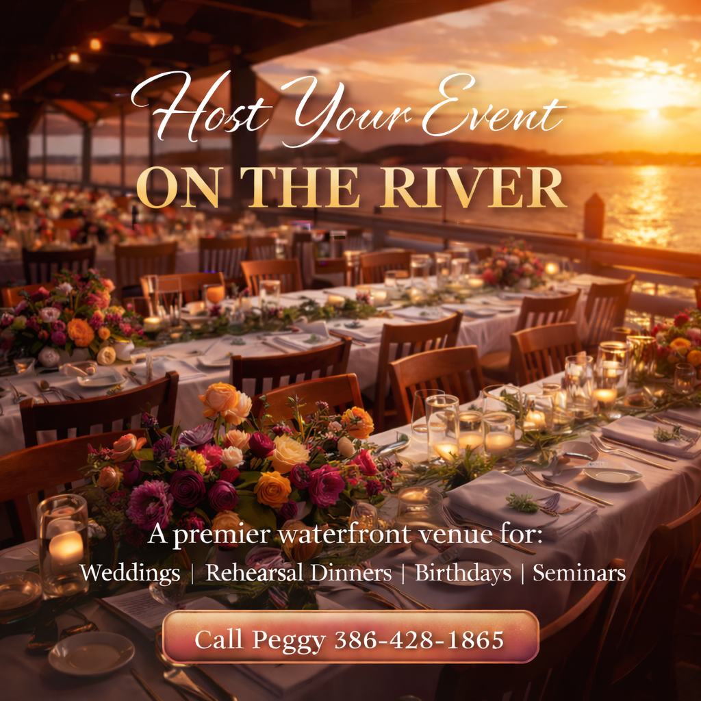 image of long tables decorated for an event on the water with the sunsetting